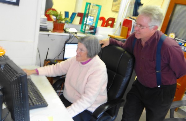 Anne Allee, a volunteer for Belfast Community Media, works at archiving community TV video clips as Ned Lightner, Belfast Community TV director, looks on. Anne Allee, a volunteer for Belfast Community Media, works at archiving community TV video clips as Ned Lightner, Belfast Community TV director, looks on.