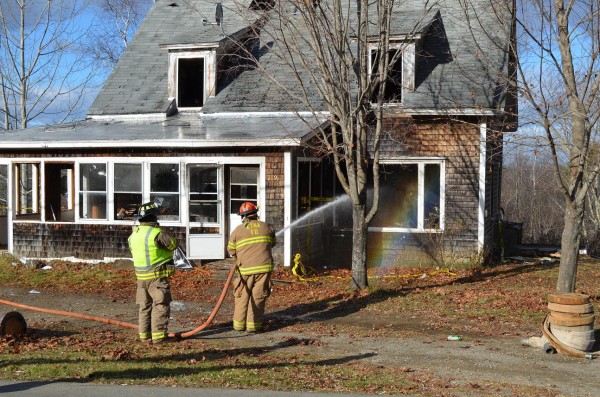 Capt. Walter Gibbons of the Etna Fire Department hoses down a house as part of a multi-department training exercise at 289 West Etna Road on Sunday, Nov. 25, 2012. Capt. Walter Gibbons of the Etna Fire Department hoses down a house as part of a multi-department training exercise at 289 West Etna Road on Sunday, Nov. 25, 2012.