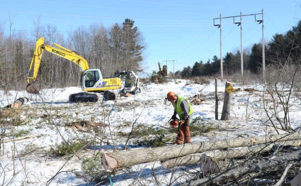 Crews from Asplundh Tree Expert Co. work on expanding CMP's power line corridor near Merrill Road in Lewiston in 2011. The Maine Public Utilities order that authorized the expansion also directed CMP on taking trees outside its rights of way for all power-line corridors in Maine. Crews from Asplundh Tree Expert Co. work on expanding CMP's power line corridor near Merrill Road in Lewiston in 2011. The Maine Public Utilities order that authorized the expansion also directed CMP on taking trees outside its rights of way for all power-line corridors in Maine.