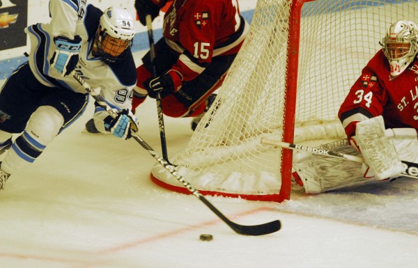 Maine's Devin Shore (94) looks to find some open net ahead of St. Lawrence goalie Matt Weninger in second-period action at Alfond Arena on Oct. 20 2012 Maine's Devin Shore (94) looks to find some open net ahead of St. Lawrence goalie Matt Weninger in second-period action at Alfond Arena on Oct. 20 2012