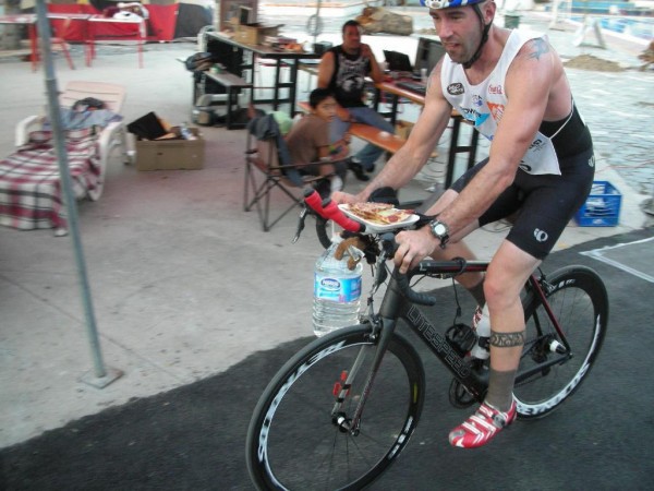 There was little time to stop for food during the World Cup Ultramarathon's decatriathlon so Kale Poland ate on the go, balancing food and water on the handlebars of his bicycle. There was little time to stop for food during the World Cup Ultramarathon's decatriathlon so Kale Poland ate on the go, balancing food and water on the handlebars of his bicycle.