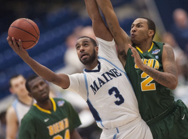 UMaine men's basketball player Jon Mesghna (3) holds off Siena College player Trenity Burdine (2) for a basket attempt in the second half of their college basketball game in Orono on Sunday, Nov. 25, 2012. UMaine men's basketball player Jon Mesghna (3) holds off Siena College player Trenity Burdine (2) for a basket attempt in the second half of their college basketball game in Orono on Sunday, Nov. 25, 2012.