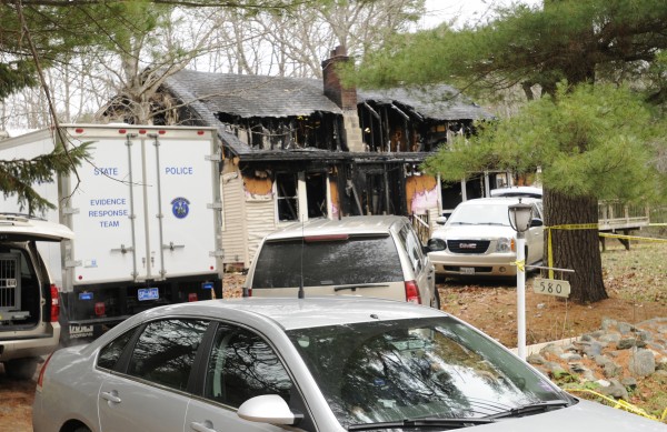Investigators were still on the scene at 580 Dow Road in Orrington on Sunday after a Saturday fire damaged the home and left a man and his three children dead. Investigators were still on the scene at 580 Dow Road in Orrington on Sunday after a Saturday fire damaged the home and left a man and his three children dead.