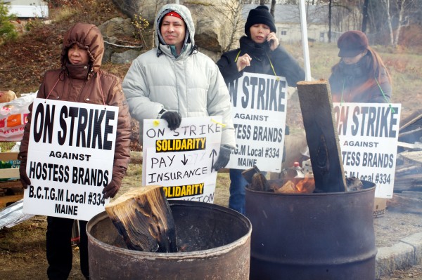 Strikers stay close to fires in barrels for warmth Friday morning Nov. 16, 2012, outside the Hostess Bakery in Biddeford. Strikers stay close to fires in barrels for warmth Friday morning Nov. 16, 2012, outside the Hostess Bakery in Biddeford.