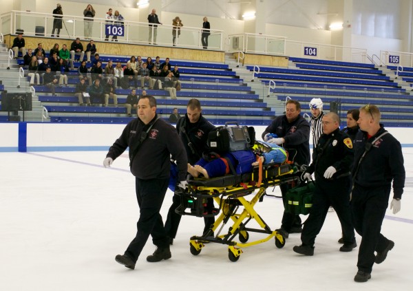 First responders leave the hockey arena ice at the University of New England in Biddeford on Friday, Nov. 16, 2012 with a life-like simulation dummy with a spinal injury during a demonstration. First responders leave the hockey arena ice at the University of New England in Biddeford on Friday, Nov. 16, 2012 with a life-like simulation dummy with a spinal injury during a demonstration.