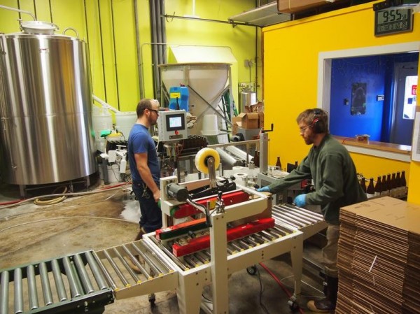 Kevin Glessing, left, and Jared Carr work the bottling line at Maine Beer Co.'s brewery off of Forest Avenue in Portland on Tuesday, Nov. 27, 2012. The brewery is expanding to Route 1 in Freeport, which will allow production to almost double and include a larger tasting room. Kevin Glessing, left, and Jared Carr work the bottling line at Maine Beer Co.'s brewery off of Forest Avenue in Portland on Tuesday, Nov. 27, 2012. The brewery is expanding to Route 1 in Freeport, which will allow production to almost double and include a larger tasting room.