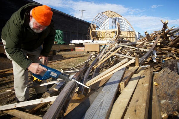 Orman Hines of Maine's First Ship cuts up rubble on Friday in Bath from a temporary boat shed that blew down in Hurricane Sandy. The shed covered the yet unfinished reproduction of the Virginia, the first European designed ship built in Maine by the Popham Colonists in 1608. Orman Hines of Maine's First Ship cuts up rubble on Friday in Bath from a temporary boat shed that blew down in Hurricane Sandy. The shed covered the yet unfinished reproduction of the Virginia, the first European designed ship built in Maine by the Popham Colonists in 1608.