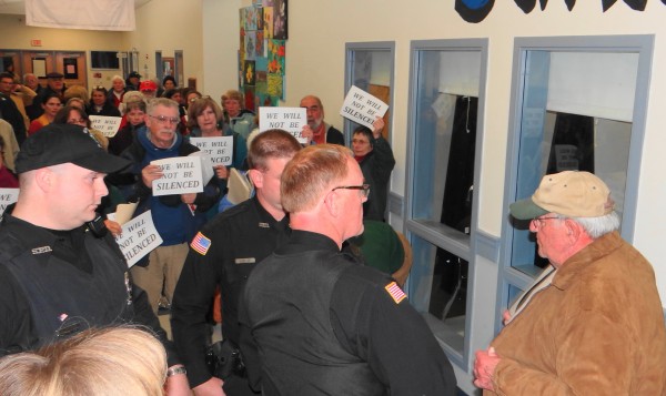 Ben Crimaudo (right) and Searsport Police Chief Dick LaHaye stand outside the planning board meeting Wednesday night, Nov. 28, 2012 as others express their anger after an officer removed Crimaudo from the meeting apparently for creating a disturbance. Ben Crimaudo (right) and Searsport Police Chief Dick LaHaye stand outside the planning board meeting Wednesday night, Nov. 28, 2012 as others express their anger after an officer removed Crimaudo from the meeting apparently for creating a disturbance.