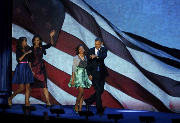 U.S. President Barack Obama, who won a second term in office by defeating Republican presidential nominee Mitt Romney, walks out with his family to address supporters during his election night rally in Chicago, Nov. 7, 2012. U.S. President Barack Obama, who won a second term in office by defeating Republican presidential nominee Mitt Romney, walks out with his family to address supporters during his election night rally in Chicago, Nov. 7, 2012.