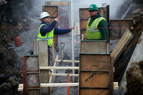 Foreman Daniel Deschenes (left) and carpenter Timber Patrick work at a Newman Concrete Services job site in Portland Tuesday Nov. 27, 2012. Their boss, F. Douglas Newman, is worried about what the Affordable Care Act might mean for small-scale employers like him. Foreman Daniel Deschenes (left) and carpenter Timber Patrick work at a Newman Concrete Services job site in Portland Tuesday Nov. 27, 2012. Their boss, F. Douglas Newman, is worried about what the Affordable Care Act might mean for small-scale employers like him.