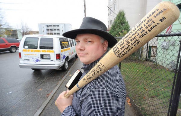 The Rev. Doug Taylor, standing in front of his Bates Street home, keeps a bat and a Bible handy to help protect him in his downtown Lewiston neighborhood. The Rev. Doug Taylor, standing in front of his Bates Street home, keeps a bat and a Bible handy to help protect him in his downtown Lewiston neighborhood.