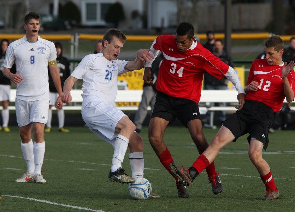 The Falmouth High School Yachtsmen's Hugh Grygiel, center left, joined by teammate JP White, left, battles Camden Hills Windjammers Colin Morse, second from right, and Alex Blohm, right, during the Maine Principals' Association Class B Boys Soccer State Championship Saturday, Nov. 3, at Scarborough High School in Scarborough, Maine, The Falmouth High School Yachtsmen's Hugh Grygiel, center left, joined by teammate JP White, left, battles Camden Hills Windjammers Colin Morse, second from right, and Alex Blohm, right, during the Maine Principals' Association Class B Boys Soccer State Championship Saturday, Nov. 3, at Scarborough High School in Scarborough, Maine,