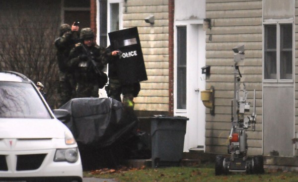 Police enter the apartment at 49 Bolling Drive in Bangor on Tuesday, Nov. 13, 2012. They found the body of a person inside but would not release the identity. Police enter the apartment at 49 Bolling Drive in Bangor on Tuesday, Nov. 13, 2012. They found the body of a person inside but would not release the identity.