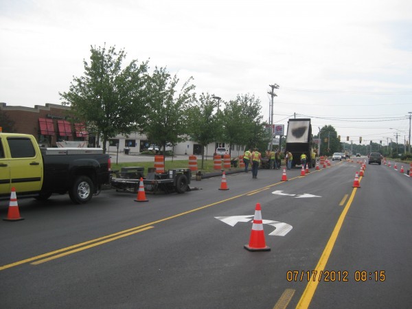Workers with local contractor Harry C. Crooker & Sons, Inc. repave lanes in July 2012 at the Cooks Corner interchange in Brunswick. The work was made possible with both state and local funds under a new Maine Department of Transportation Municipal Partnership Initiative. Workers with local contractor Harry C. Crooker & Sons, Inc. repave lanes in July 2012 at the Cooks Corner interchange in Brunswick. The work was made possible with both state and local funds under a new Maine Department of Transportation Municipal Partnership Initiative.