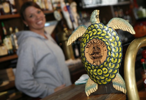 Paul and wife Pam Cochrane (both not pictured) transform bottle caps into folk art, including mermaids, starfish, fish of all types, crabs and sea turtles, marketed under the name Beach House Bottlecap Art. Paul gets most of his caps from the Yorktown Pub, he made this turtle for them. Paul and wife Pam Cochrane (both not pictured) transform bottle caps into folk art, including mermaids, starfish, fish of all types, crabs and sea turtles, marketed under the name Beach House Bottlecap Art. Paul gets most of his caps from the Yorktown Pub, he made this turtle for them.
