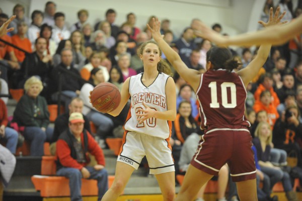 Brewer High School's Maddy Bailey (20) looks for an open player while Bangor High School's Denae Johnson (10) covers her during a game last season at Brewer High School. Brewer High School's Maddy Bailey (20) looks for an open player while Bangor High School's Denae Johnson (10) covers her during a game last season at Brewer High School.