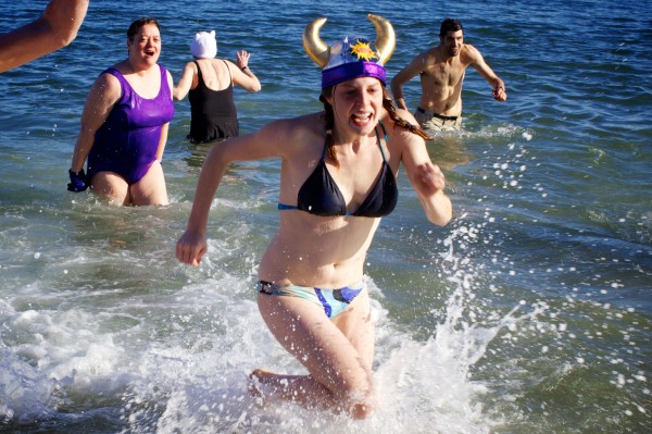 Winter dippers emerge from the frigid waters of Casco Bay at Portland's East End Beach on Monday, Dec. 31, 2012 at the Natural Resources Council of Maine's annual New Year's Eve Polar Bear Dip and Dash fundraiser which includes a 5k run and a quick dunk in the water. Winter dippers emerge from the frigid waters of Casco Bay at Portland's East End Beach on Monday, Dec. 31, 2012 at the Natural Resources Council of Maine's annual New Year's Eve Polar Bear Dip and Dash fundraiser which includes a 5k run and a quick dunk in the water.