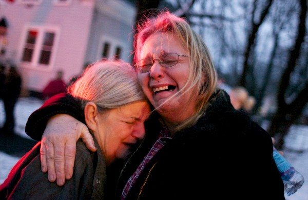 Susan Savage (left) embraces Wendy Shea after their home, a duplex at 108 Third St. in Bangor, caught fire Thursday afternoon leaving them without a home for the holidays. Susan Savage (left) embraces Wendy Shea after their home, a duplex at 108 Third St. in Bangor, caught fire Thursday afternoon leaving them without a home for the holidays.
