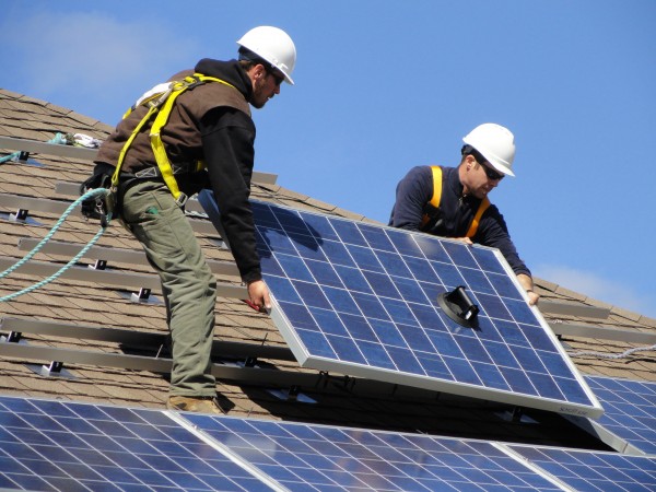 Installers with Sundog Solar Store of Searsport affix photovoltaic panels on the Searsmont Town Office. Installers with Sundog Solar Store of Searsport affix photovoltaic panels on the Searsmont Town Office.