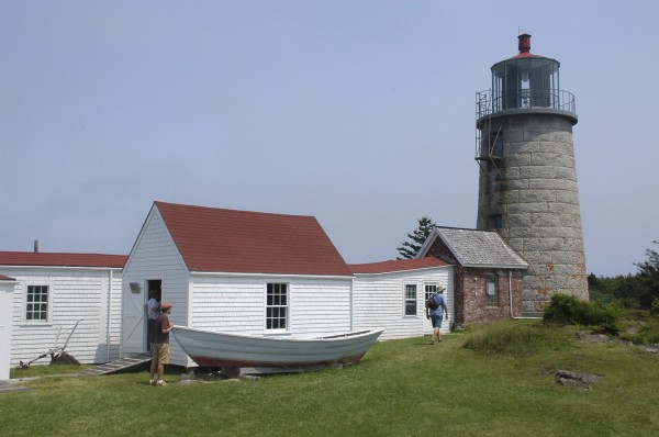 Tourists explore the grounds around Monhegan Island Lighthouse in March. The island community has a year-round population of about 70. Tourists explore the grounds around Monhegan Island Lighthouse in March. The island community has a year-round population of about 70.