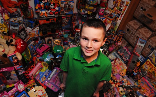 Brayden Mott of Orrington stands surrounded by the almost 2012 toys he has amassed to be given to needy children in the greater Bangor area. Brayden Mott of Orrington stands surrounded by the almost 2012 toys he has amassed to be given to needy children in the greater Bangor area.
