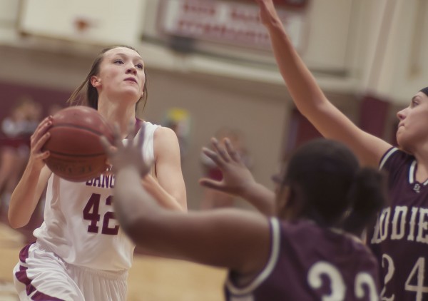 Mary Butler (left) of Bangor High School drives to the basket against pressure from Edward Little defenders Emily Jacques (right) and Eraleena Hairston during Saturday night's game in Bangor. Edward Little won 61-49. Mary Butler (left) of Bangor High School drives to the basket against pressure from Edward Little defenders Emily Jacques (right) and Eraleena Hairston during Saturday night's game in Bangor. Edward Little won 61-49.