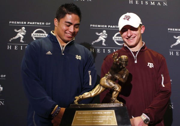 Heisman Trophy candidates, Texas A&M quarterback Johnny Manziel (right) and Notre Dame University linebacker Manti Te'o (left) pose with the Heisman Trophy, awarded to college football's most outstanding player, in New York, on Friday. The 2012 Heisman Trophy will be presented on Saturday in New York. Heisman Trophy candidates, Texas A&M quarterback Johnny Manziel (right) and Notre Dame University linebacker Manti Te'o (left) pose with the Heisman Trophy, awarded to college football's most outstanding player, in New York, on Friday. The 2012 Heisman Trophy will be presented on Saturday in New York.