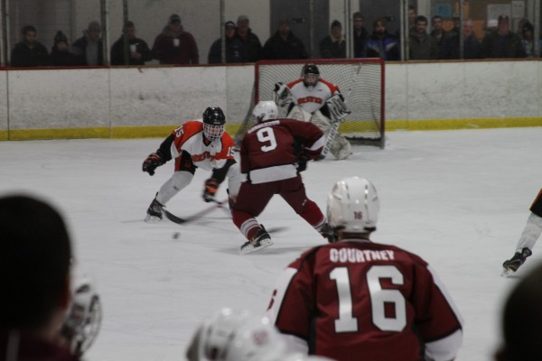 Parker Sanderson (9) of Bangor faces Brewer's #15, Jimmy Donnelly, on his way to the net. Trailed by Bangor teammate Justin Courtney. Parker Sanderson (9) of Bangor faces Brewer's #15, Jimmy Donnelly, on his way to the net. Trailed by Bangor teammate Justin Courtney.