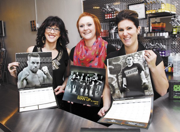 Regina Leonard (right), co-owner of The L Factor in Brewer and project leader for the Man Up to Cancer calendar, shows off one of the calendars along with her business partner Jodi Leighton (left) and employee Stephanie Knowles. Leonard wanted to draw attention to men’s cancers with the calendar, which she hopes will raise at least $10,000 that will be donated to the Lafayette Family Cancer Center. Regina Leonard (right), co-owner of The L Factor in Brewer and project leader for the Man Up to Cancer calendar, shows off one of the calendars along with her business partner Jodi Leighton (left) and employee Stephanie Knowles. Leonard wanted to draw attention to men’s cancers with the calendar, which she hopes will raise at least $10,000 that will be donated to the Lafayette Family Cancer Center.