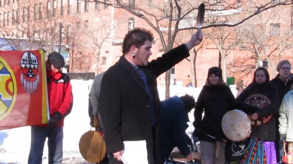 George Neptune, a member of the Passamaquoddy Tribe and educator at the Abbe Museum in Bar Harbor, hold up a feather after a speech on Saturday, Jan. 5, 2013, at an Idle No More rally in Portland. The rally was held to show solidarity with indigenous people worldwide. George Neptune, a member of the Passamaquoddy Tribe and educator at the Abbe Museum in Bar Harbor, hold up a feather after a speech on Saturday, Jan. 5, 2013, at an Idle No More rally in Portland. The rally was held to show solidarity with indigenous people worldwide.