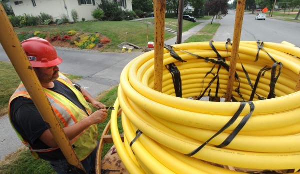 Andy Moody, a foreman for Ypsilanti, Mich.-based InfraSource, cuts tape from a 2-inch gas line he was laying on Norway Road in Bangor in July 2011. Andy Moody, a foreman for Ypsilanti, Mich.-based InfraSource, cuts tape from a 2-inch gas line he was laying on Norway Road in Bangor in July 2011.