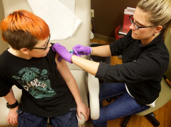 Certified Medical Assistant Shannon Martin gives Kay'l Sibold, 10, a flu shot at a Martin's Point Healthcare pediatric flu clinic in Portland on Friday, Jan. 11, 2013. Certified Medical Assistant Shannon Martin gives Kay'l Sibold, 10, a flu shot at a Martin's Point Healthcare pediatric flu clinic in Portland on Friday, Jan. 11, 2013.