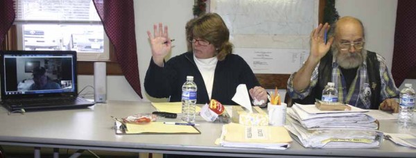 Sangerville Selectmen Melissa Randall and Tom Carone vote on Dec. 28 to allow Irving McNaughton to participate by Internet during last weeks board meeting. McNaughton seen in the computer screen on the left is spending several weeks in Florida and requested to participate in selectmens meeting via Skype until he returns in March. Sangerville Selectmen Melissa Randall and Tom Carone vote on Dec. 28 to allow Irving McNaughton to participate by Internet during last weeks board meeting. McNaughton seen in the computer screen on the left is spending several weeks in Florida and requested to participate in selectmens meeting via Skype until he returns in March.
