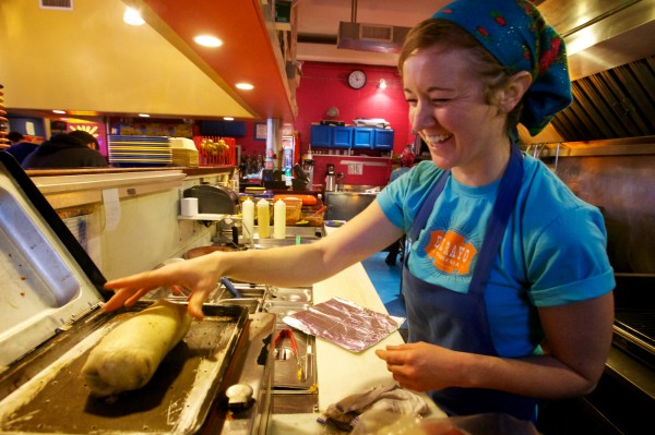 Casey Turner of El Rayo Taqueria in Portland makes a $5 burrito during a snowstorm Wednesday, Jan. 16, 2013. The Mexican eatery offers the $5 burrito special whenever the city calls a parking ban. Casey Turner of El Rayo Taqueria in Portland makes a $5 burrito during a snowstorm Wednesday, Jan. 16, 2013. The Mexican eatery offers the $5 burrito special whenever the city calls a parking ban.
