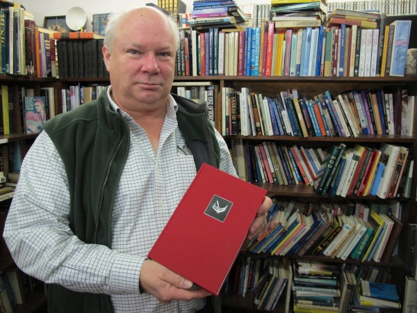 Michael Riggs of Scottie's Bookhouse in Hancock shows off a limited-edition, signed copy of Stephen King's "The Regulators," written in 1996 under a pseudonym. Riggs managed the book's auction, the proceeds of which benefit the Emmaus Homeless Shelter's efforts to keep Mainers warm this winter. Michael Riggs of Scottie's Bookhouse in Hancock shows off a limited-edition, signed copy of Stephen King's "The Regulators," written in 1996 under a pseudonym. Riggs managed the book's auction, the proceeds of which benefit the Emmaus Homeless Shelter's efforts to keep Mainers warm this winter.