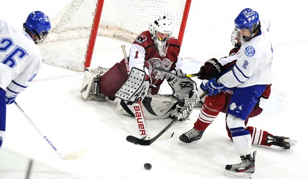Lewiston's Matt Poulin (left) and Evan Gosselin (right) look to pounce on a rebound, but Bangor goalie Rye Powell swept it away with his stick during a game at the Androscoggin Bank Colisee in Lewiston on Monday, Jan. 21, 2013. Lewiston's Matt Poulin (left) and Evan Gosselin (right) look to pounce on a rebound, but Bangor goalie Rye Powell swept it away with his stick during a game at the Androscoggin Bank Colisee in Lewiston on Monday, Jan. 21, 2013.