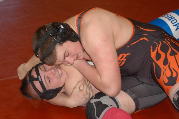 Morse High School's Austin Talgo is tied up by Brewer's Victor Irwin in their 220-pound match during the KVAC championships Saturday at Cony High School in Augusta. Morse High School's Austin Talgo is tied up by Brewer's Victor Irwin in their 220-pound match during the KVAC championships Saturday at Cony High School in Augusta.