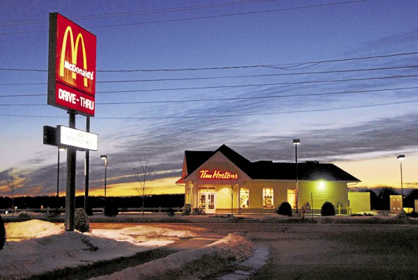 The mid-January dawn frames Tim Hortons and the McDonalds sign on Main Street about 6:25 a.m. on a cool, calm January weekday morning. The mid-January dawn frames Tim Hortons and the McDonalds sign on Main Street about 6:25 a.m. on a cool, calm January weekday morning.