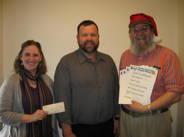 Local business owners Debra Bell (left) and Don Hanson (right) present checks to Rob Crone, director of nutrition at the Eastern Area Agency on Aging. Bell and Hanson collaborated on a joint pet-photo shoot that helped raise money for EAAA’s Furry Friends Food Bank. Local business owners Debra Bell (left) and Don Hanson (right) present checks to Rob Crone, director of nutrition at the Eastern Area Agency on Aging. Bell and Hanson collaborated on a joint pet-photo shoot that helped raise money for EAAA’s Furry Friends Food Bank.