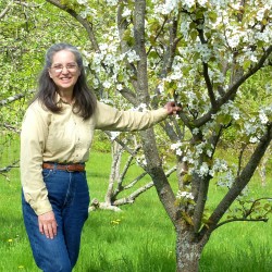 Ana in her orchard. Ana in her orchard.