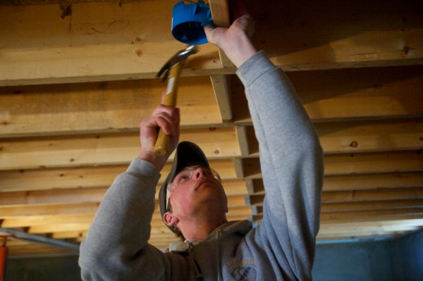 Mitchell Cummings, a electrical technology student the Bath Regional Career and Technical Center, installs a light fixture service box in a house on Middle Street Monday, Jan. 14, 2013. Mitchell Cummings, a electrical technology student the Bath Regional Career and Technical Center, installs a light fixture service box in a house on Middle Street Monday, Jan. 14, 2013.