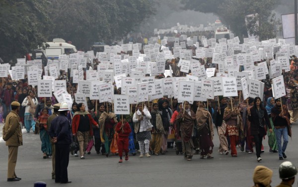 Women hold placards as they march recently during a rally protesting for justice and security for women, in New Delhi. A rape last month of a physiotherapy student on a moving bus and her death on Dec. 28, 2012 triggered a national debate about how to better protect women in India. Women hold placards as they march recently during a rally protesting for justice and security for women, in New Delhi. A rape last month of a physiotherapy student on a moving bus and her death on Dec. 28, 2012 triggered a national debate about how to better protect women in India.