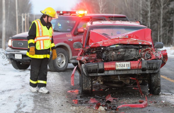 A member of the Dixmont Fire Department inspects the damage to a Jeep after it ran into the back of a school bus on Route 9/202 near box 1185 on Monday. A member of the Dixmont Fire Department inspects the damage to a Jeep after it ran into the back of a school bus on Route 9/202 near box 1185 on Monday.