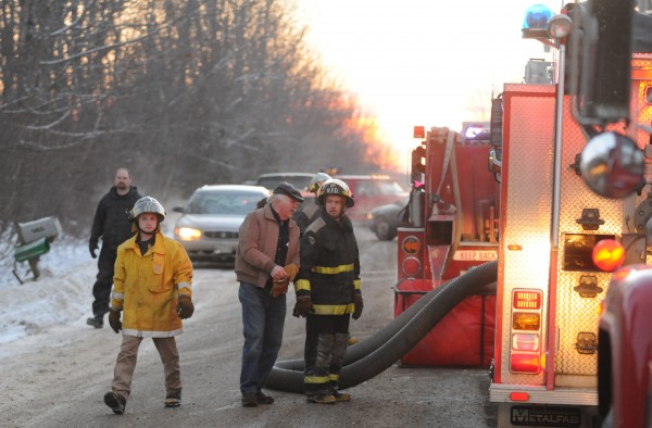 Winterport Fire Department personnel man fire fighting equipment at 165 Monroe Road in Monroe on Sunday during a garage fire. Winterport Fire Department personnel man fire fighting equipment at 165 Monroe Road in Monroe on Sunday during a garage fire.
