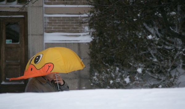 A man smokes a cigarette on Harlow Street in Bangor on Saturday during the snowstorm. A man smokes a cigarette on Harlow Street in Bangor on Saturday during the snowstorm.
