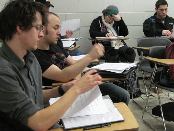 Patrick Howard (left), 21, flips through writing he plans to share during a discussion in a Wednesday morning class at Southern Maine Community College's South Portland campus. The school's new slate of 7 a.m. classes have proven popular, community college officials have said. Patrick Howard (left), 21, flips through writing he plans to share during a discussion in a Wednesday morning class at Southern Maine Community College's South Portland campus. The school's new slate of 7 a.m. classes have proven popular, community college officials have said.