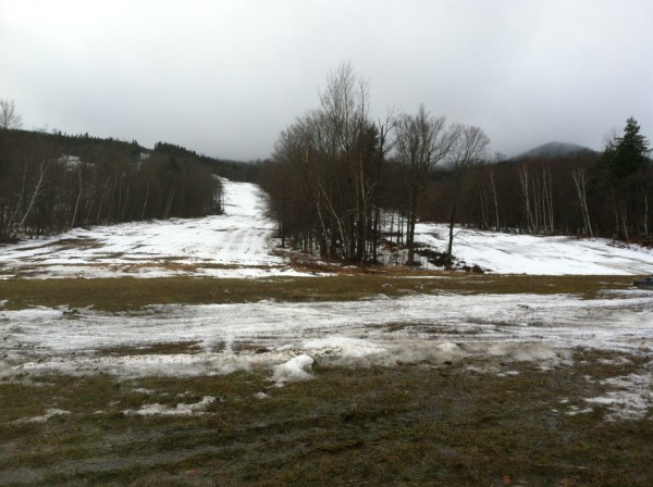Warm weather and rain have caused green grass to show through many places of Squaw Mountain Ski Resort in Big Moose Township on Thursday, Jan. 31, 2013. Warm weather and rain have caused green grass to show through many places of Squaw Mountain Ski Resort in Big Moose Township on Thursday, Jan. 31, 2013.