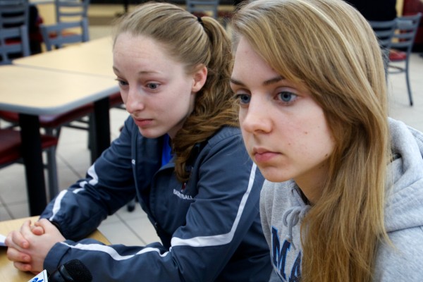 During a stop at the Kennebunk rest stop on the Maine Turnpike Wednesday, University of Maine women's basketball players point guard Courtney Anderson (left) and forward Liz Wood talk about the crash that wrecked their team bus Tuesday night. During a stop at the Kennebunk rest stop on the Maine Turnpike Wednesday, University of Maine women's basketball players point guard Courtney Anderson (left) and forward Liz Wood talk about the crash that wrecked their team bus Tuesday night.