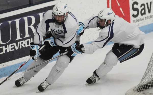 UMaine hockey players Steven Swavely (left) and his brother Jon Swavely skate during practice on Thursday, Feb. 7, 2013 at Alfond Arena in Orono. UMaine players have suffered seven concussions so far this year, which is up from an average of two to three head injuries over the past years. UMaine hockey players Steven Swavely (left) and his brother Jon Swavely skate during practice on Thursday, Feb. 7, 2013 at Alfond Arena in Orono. UMaine players have suffered seven concussions so far this year, which is up from an average of two to three head injuries over the past years.