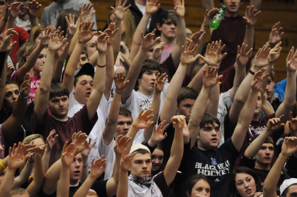 Members of the Nokomis student body hold their hands aloft as last-minute foul shots put their team ahead of Belfast at the Bangor Auditorium on Friday, Feb. 15, 2013. Members of the Nokomis student body hold their hands aloft as last-minute foul shots put their team ahead of Belfast at the Bangor Auditorium on Friday, Feb. 15, 2013.